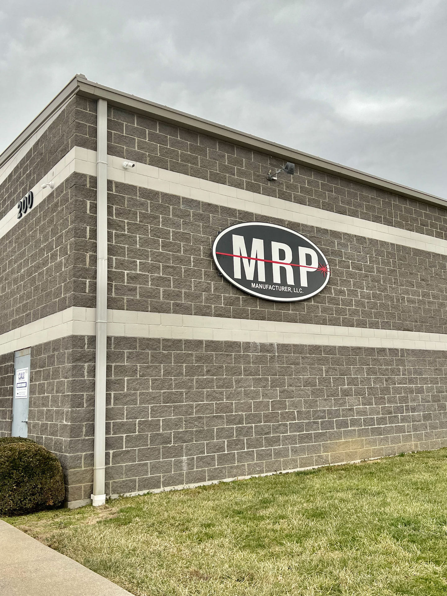 MRP Manufacturer building signage on industrial brick wall